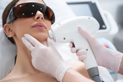 Client experiencing comfortable Cervello Painless laser hair removal at Kansas City's exclusive Aesthetics For Women clinic. Professional KC technician using advanced painless technology for permanent hair reduction with maximum comfort and effectiveness.