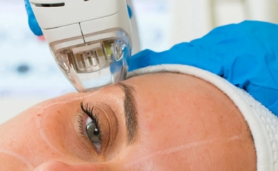 Elegant mature woman receiving premium neurotoxin injection treatment at Kansas City's Aesthetics For Women clinic. Expert Missouri medical professional administering precise anti-aging therapy for smoother skin and reduced wrinkles.